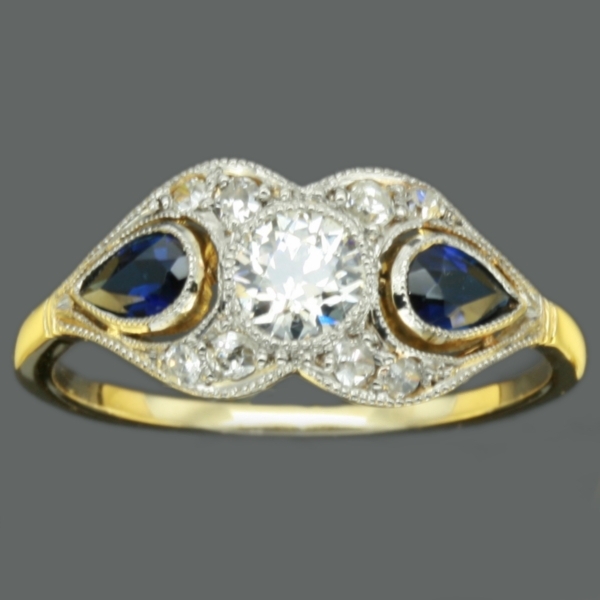Charming vintage engagement ring with diamonds and sapphires